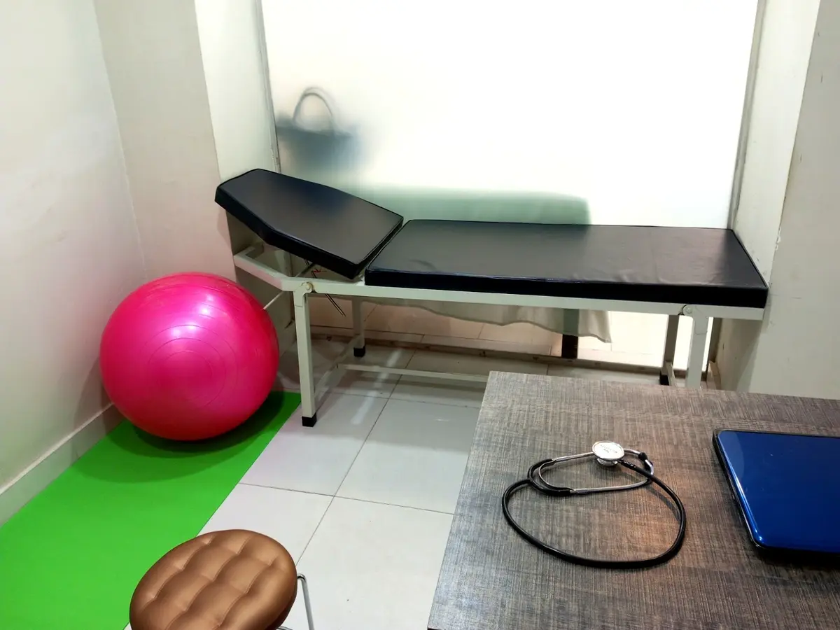 A treatment room at PhysioCare Clinic with a treatment bed and exercise ball